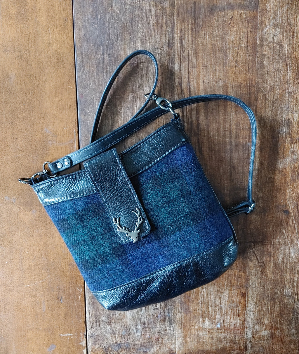 A Highland Swish in Leather with Black Watch Harris Tweed