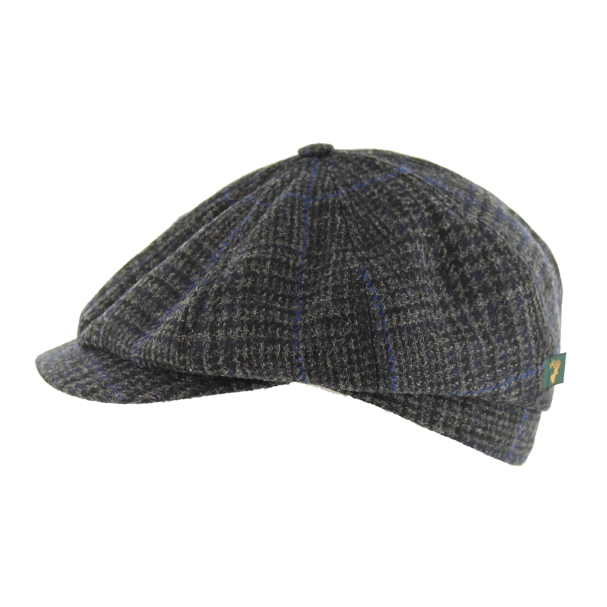 Charcoal, black and royal check 8 panel also called an Ivy cap. It is the style worn in Peaky Blinders. Sold in London, Ontario