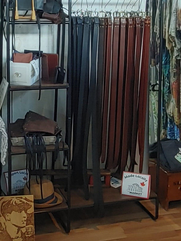 Belts on display at Plumage Studio