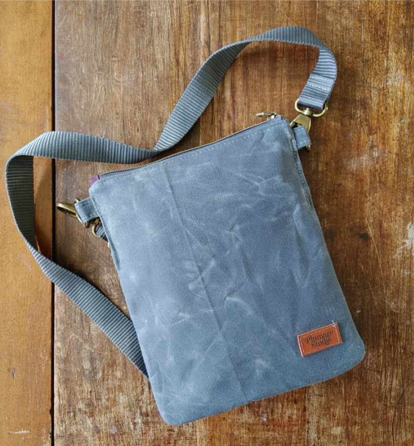 A Sparrow Crossbody in Waxed Canvas and Harris Tweed