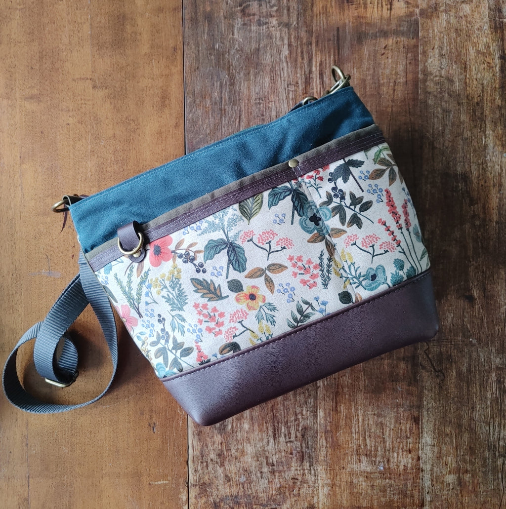 A Starling Handbag in Leather with Olive and Teal Waxed Canvas with Floral