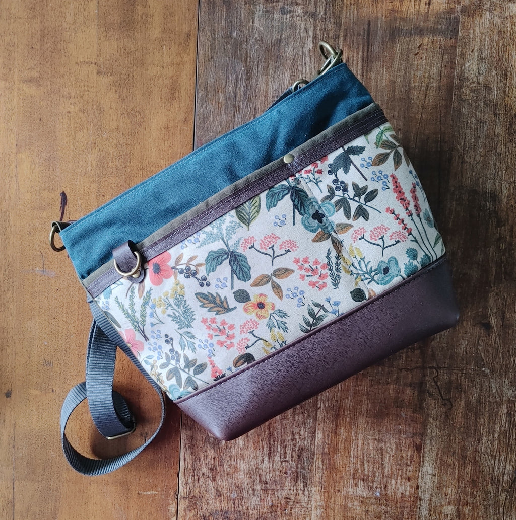 A Starling Handbag in Leather with Olive and Teal Waxed Canvas with Floral