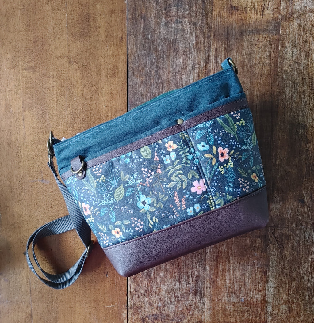 A Starling Handbag in Leather and Teal Waxed Canvas with Floral