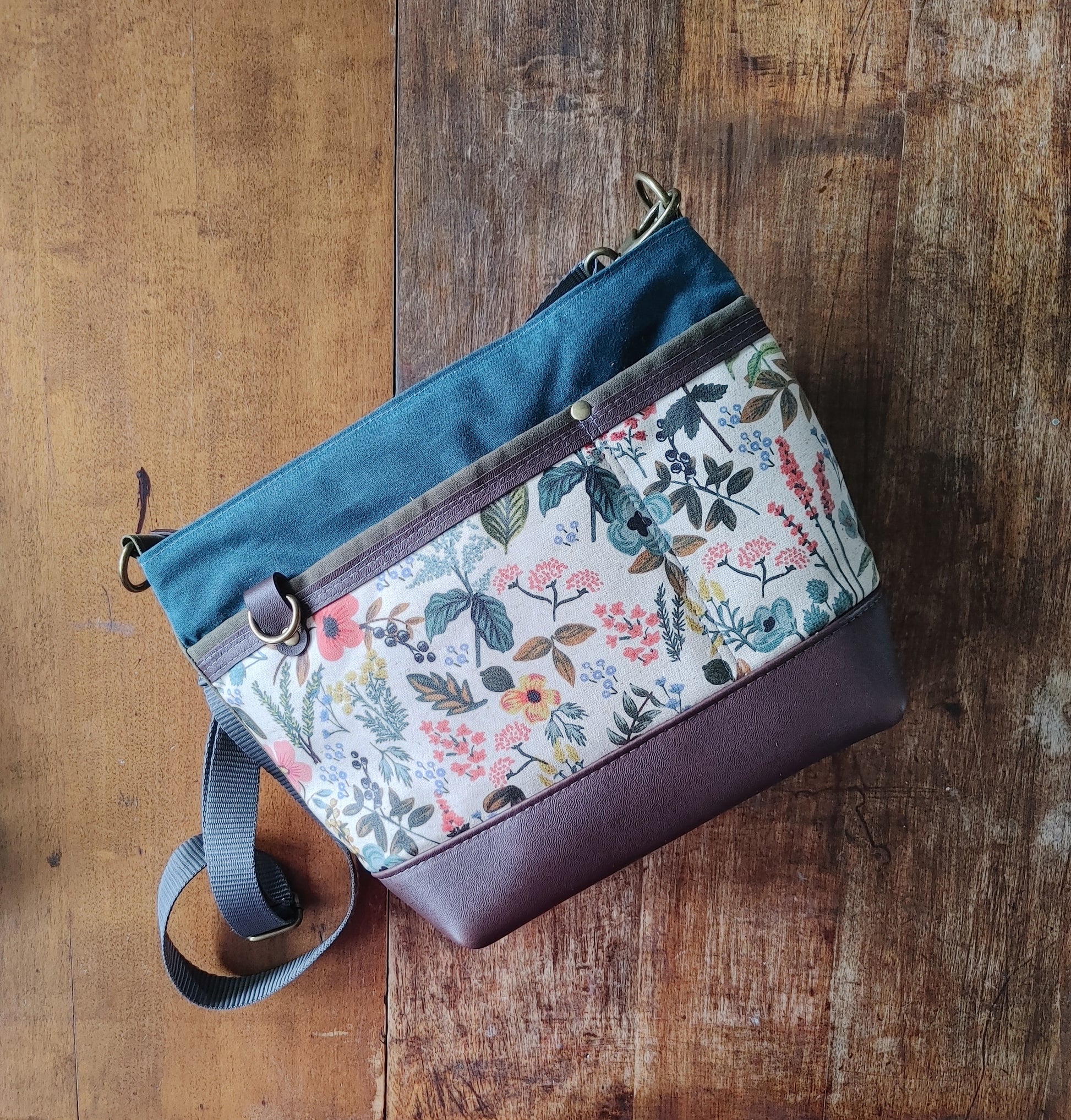 A Starling Handbag in Leather with Olive and Teal Waxed Canvas with Floral