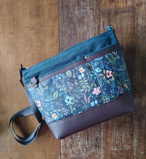 A Starling Handbag in Leather and Teal Waxed Canvas with Floral