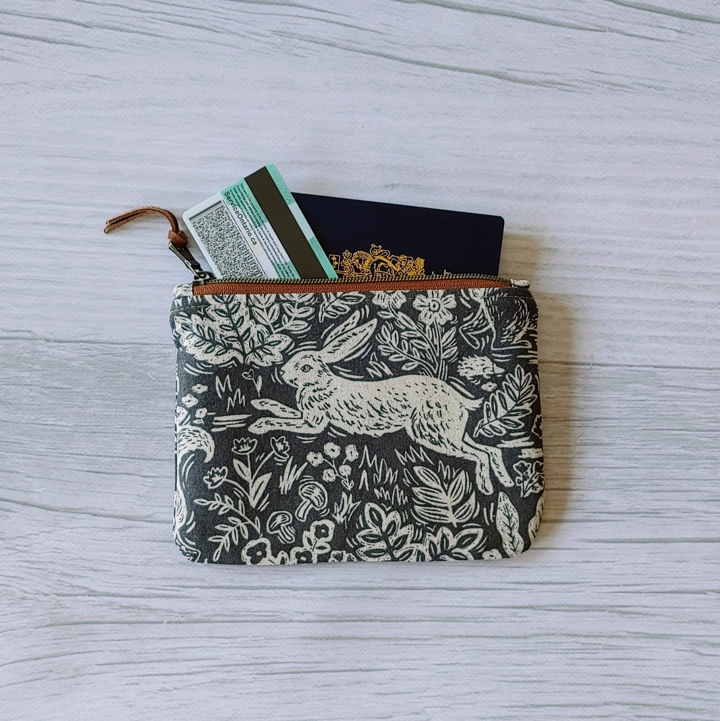Passport Pouch in Fable Hare by Rifle Paper Co print. From Plumage Studio Accessories