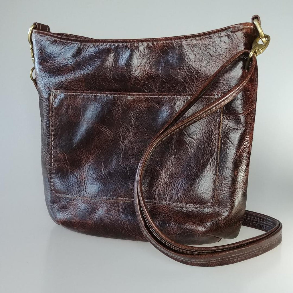 A Highland Swish in Leather with Black Watch Harris Tweed